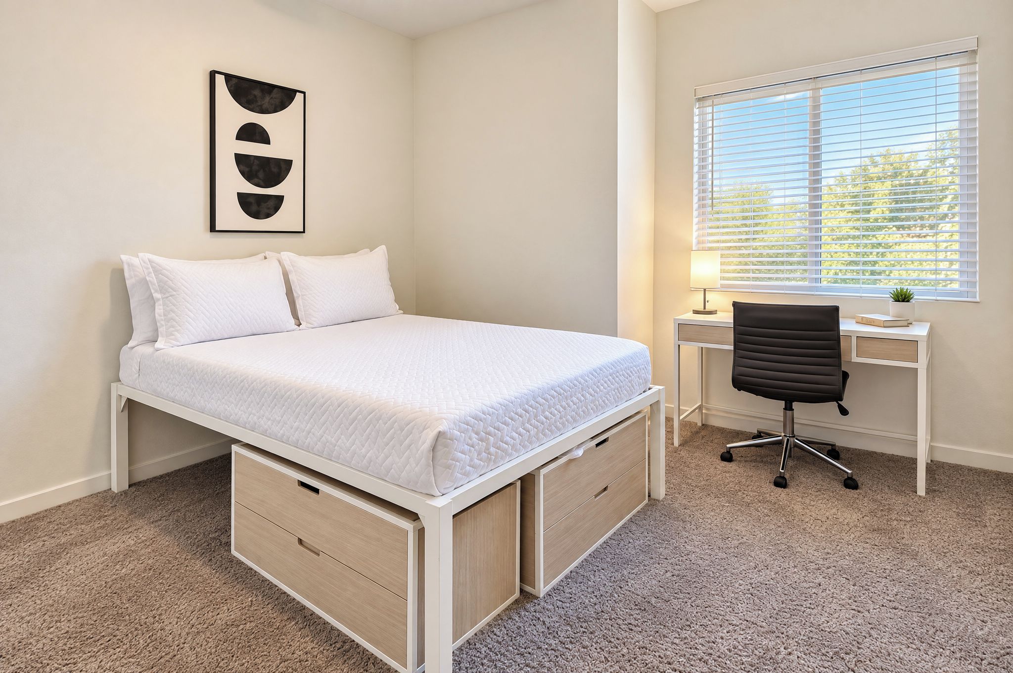 A bedroom with a bed, a desk, and a chair.