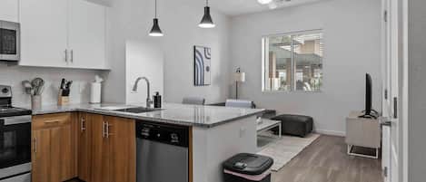 Full-size fridge, microwave, stovetop, dishwasher