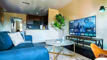 Standard Apartment, 1 Bedroom (Apartment) | Living area | 50-inch Smart TV with digital channels