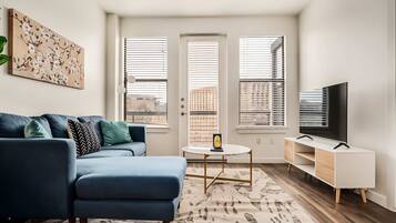 Standard Apartment, 2 Bedrooms (Apartment) | Living area | 50-inch Smart TV with digital channels