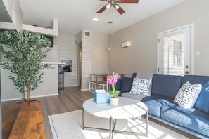 Standard Apartment, 1 Bedroom (Apartment) | Living area | 50-inch Smart TV with digital channels - Irving Apartments (Irving)