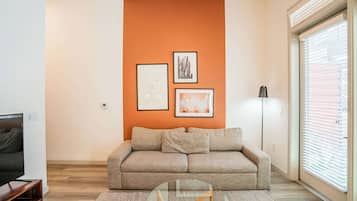Standard Apartment, 1 Bedroom (Apartment) | Living area | 50-inch Smart TV with digital channels