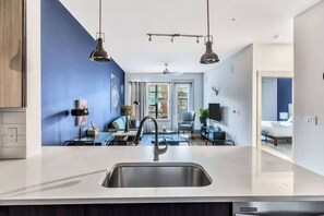 Standard Apartment, 1 Bedroom (Apartment) | Living area | 50-inch Smart TV with digital channels - Boulevard Stays - Richardson (Plano)