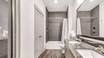 Combined shower/tub, hair dryer, towels, soap