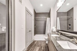 Combined shower/bathtub, hair dryer, towels, soap