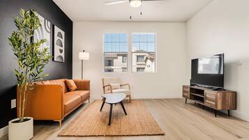 Standard Apartment, 1 Bedroom (Apartment) | Living area | 50-inch Smart TV with digital channels