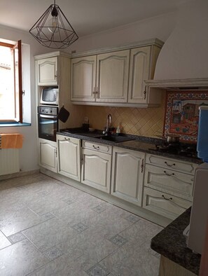 Fridge, microwave, cookware/dishes/utensils