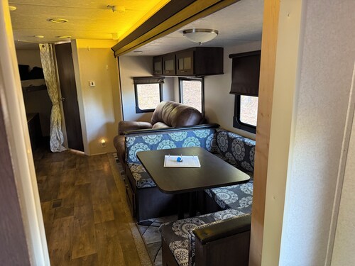 Camper in country setting beside water, near Burning Star Wildlife area