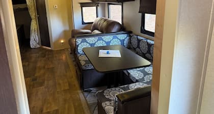 Camper in country setting beside water, near Burning Star Wildlife area