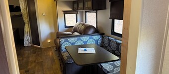 Camper in country setting beside water, near Burning Star Wildlife area