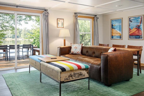 Cozy lakeside retreat with stunning water views and a spacious deck. Perfect for a relaxing getaway!