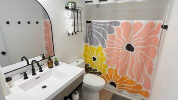 Hair dryer, towels, soap, toilet paper