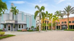 A building with a cinema and a gym. - Paseo Grande 3 Bedroom Resort Oasis (Fort Myers)