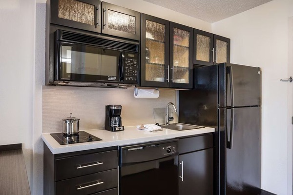 Brew coffee and prep snacks with convenient in-room appliances.