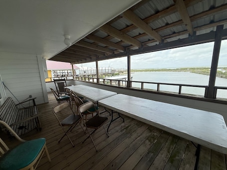 Outdoor dining. Thunderbend Coastal Realty Group