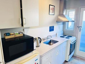 Fridge, coffee/tea maker, electric kettle, toaster
