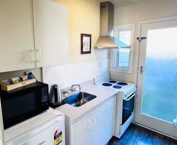 Coffee/tea maker, electric kettle, toaster, dining tables