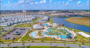 A residential area with a swimming pool complex and a marina. - 4BR/3BA Townhouse w/ Private Pool in Storey Lake (Kissimmee)