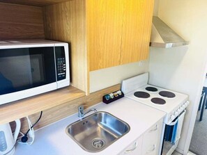 Fridge, coffee/tea maker, electric kettle, toaster