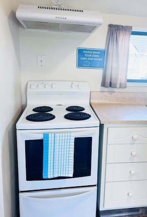Fridge, electric kettle, toaster, dining tables