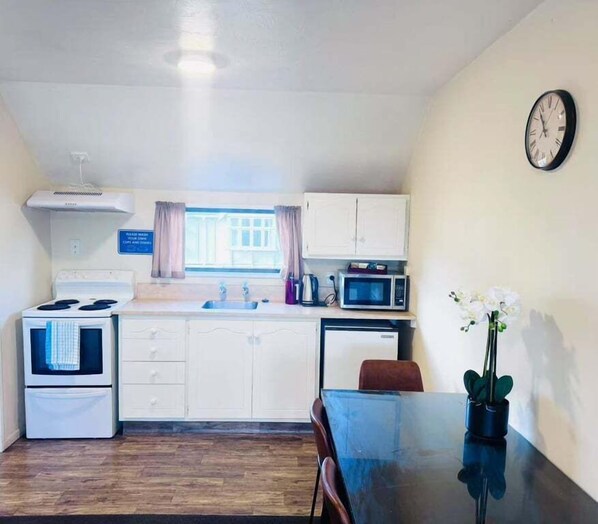 Fridge, electric kettle, toaster, dining tables