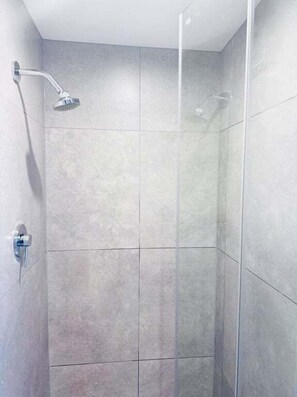 Hair dryer, towels, shampoo, toilet paper