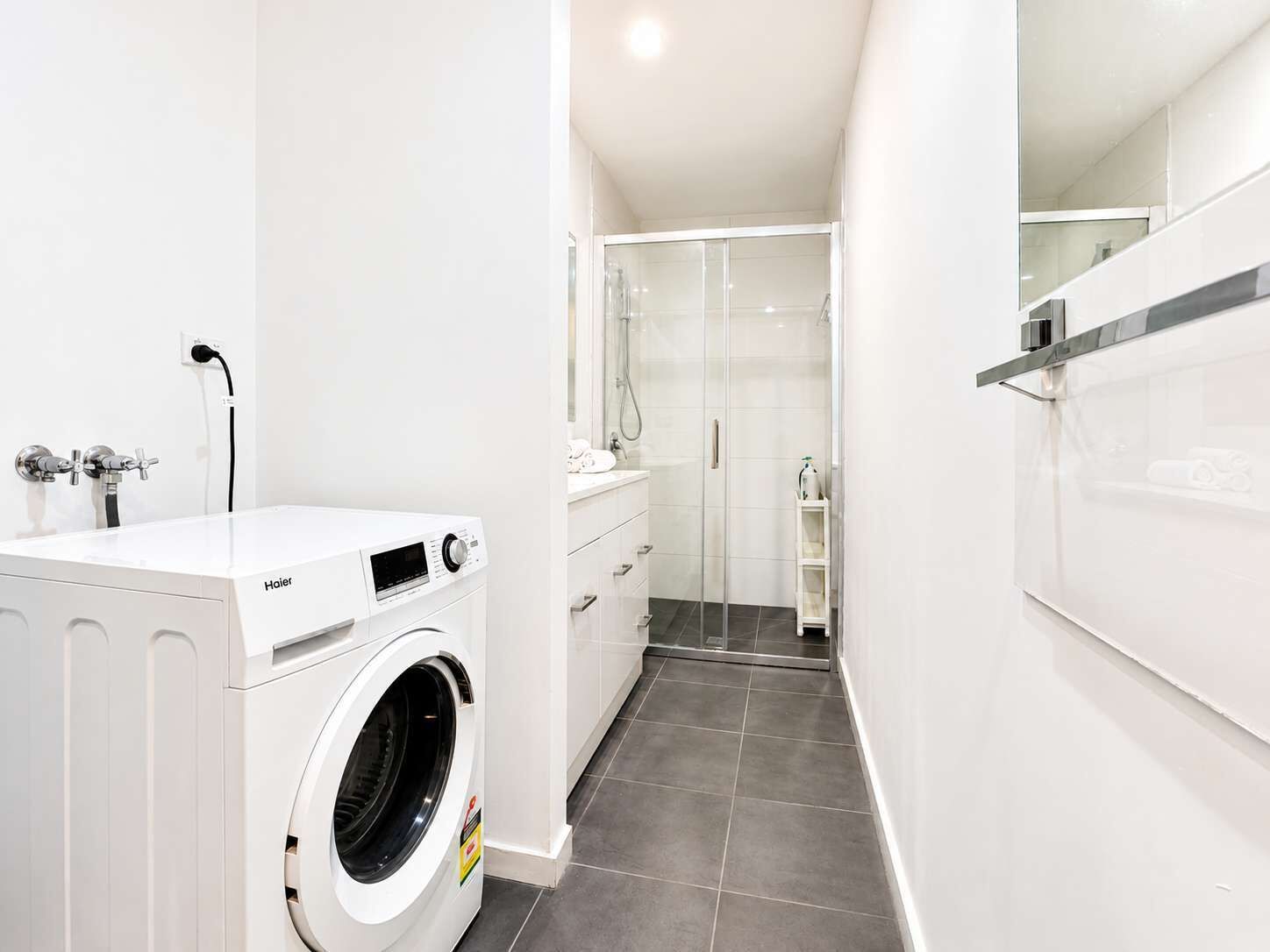Shower, hair dryer, towels, shampoo