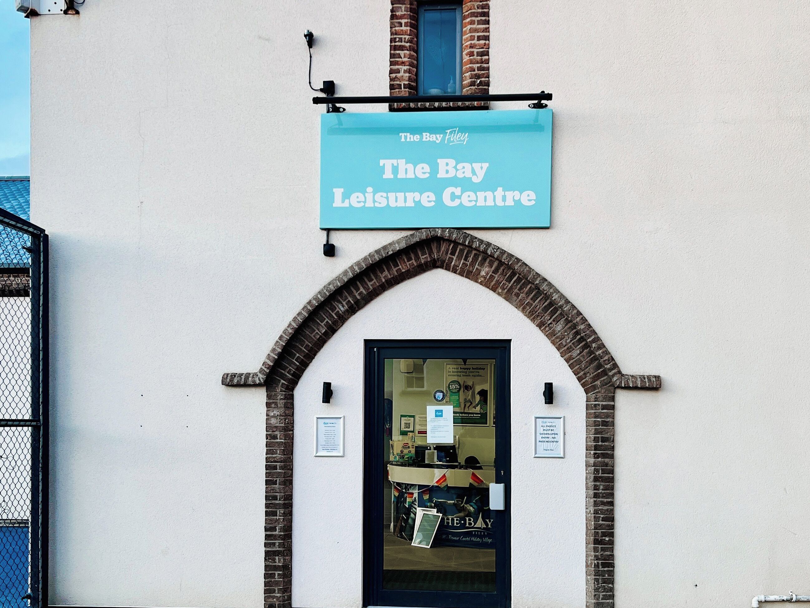 A building with a sign reading 'The Bay Leisure Centre' above a dark entrance.
