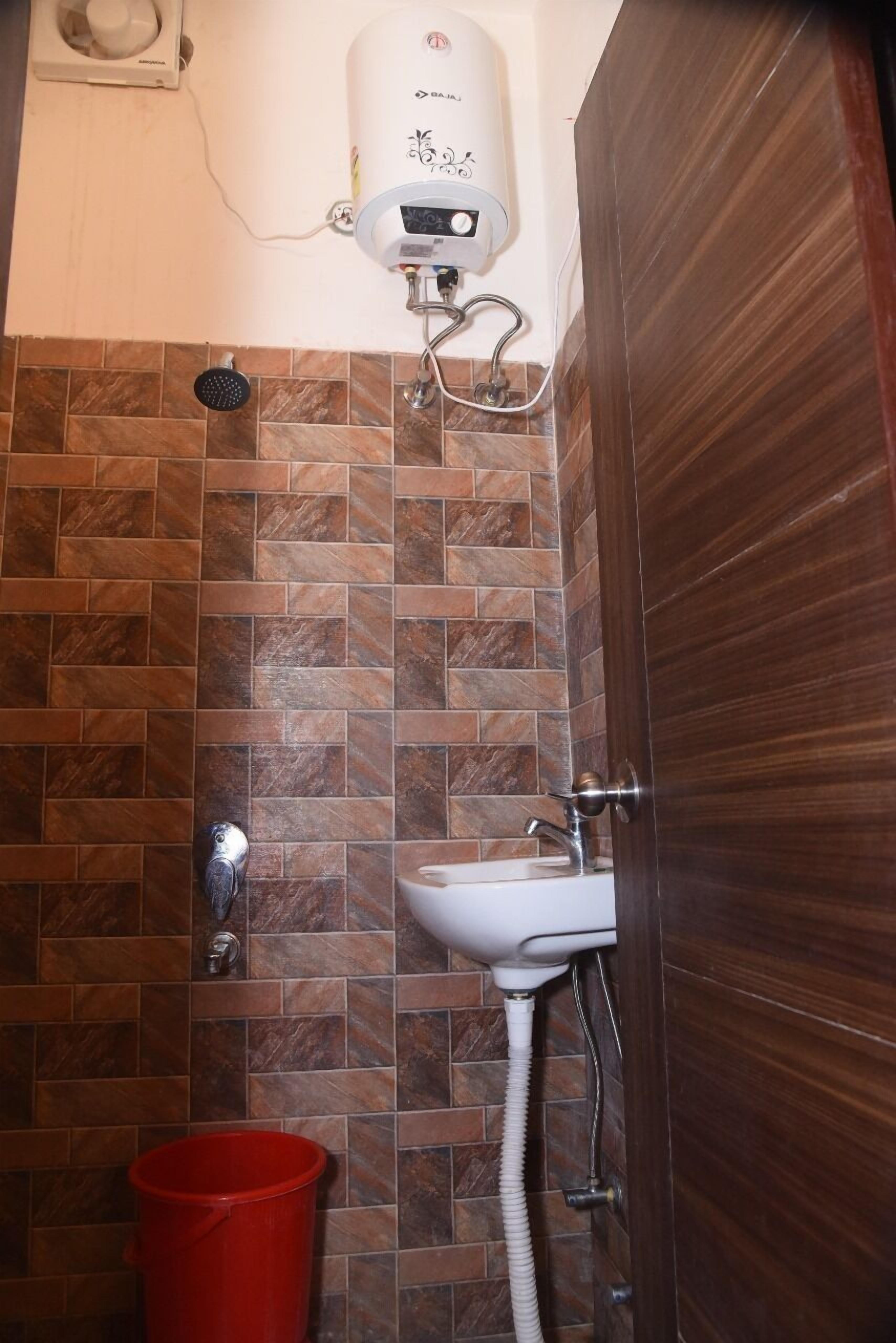 Shower, rainfall showerhead, towels, soap