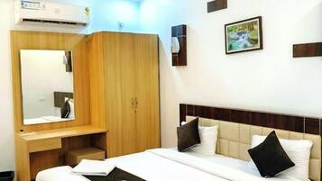 Premium bedding, desk, laptop workspace, soundproofing