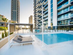 Outdoor pool - Vogue | Binghatti Corner JVC near Circle Mall (Dubai)