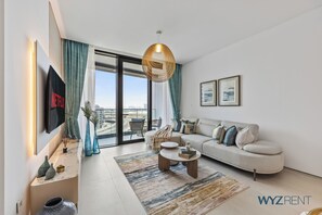 Luxury Apartment, 1 Bedroom, Canal View | Living area | 55-inch Smart TV with digital channels, Netflix, streaming services - Luxury 1BR Address JBR Beachfront (Dubai)