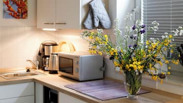 Réfrigérateur, micro-ondes, lave-vaisselle, cafetiÚre/bouilloire