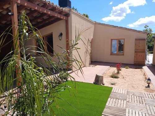 Rural apartment with garden and elevated swimming pool.