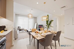 Standard Apartment, City View | In-room dining - WYZ RENT|Serene 1 BR in Surf 2-Creek Beach Access (Dubai)