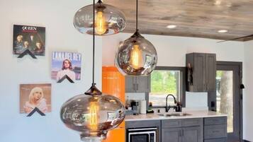 Fridge, microwave, coffee/tea maker, cookware/dishes/utensils