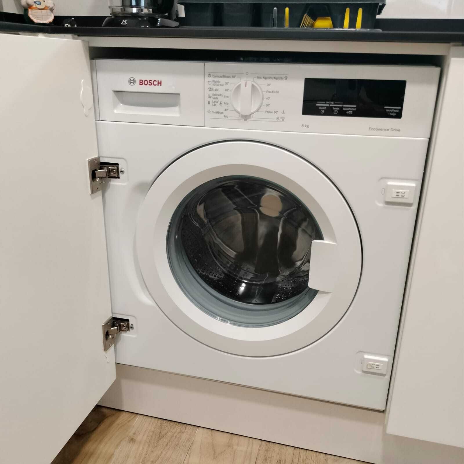 A Bosch washing machine in a kitchen setting.