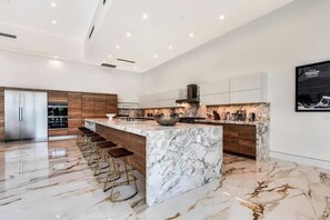 Fridge, microwave, oven, stovetop - Sleeps 28 | 2 Luxe Villas w/ Pickleball Court | Bravo Villas Dorada by AvantStay (Indio)