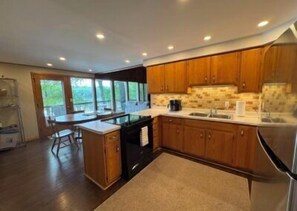 Fridge, microwave, oven, stovetop - Stepaway Vacation Rentals- Circle of Pines Oak Leaf Lodge (St.Germain)