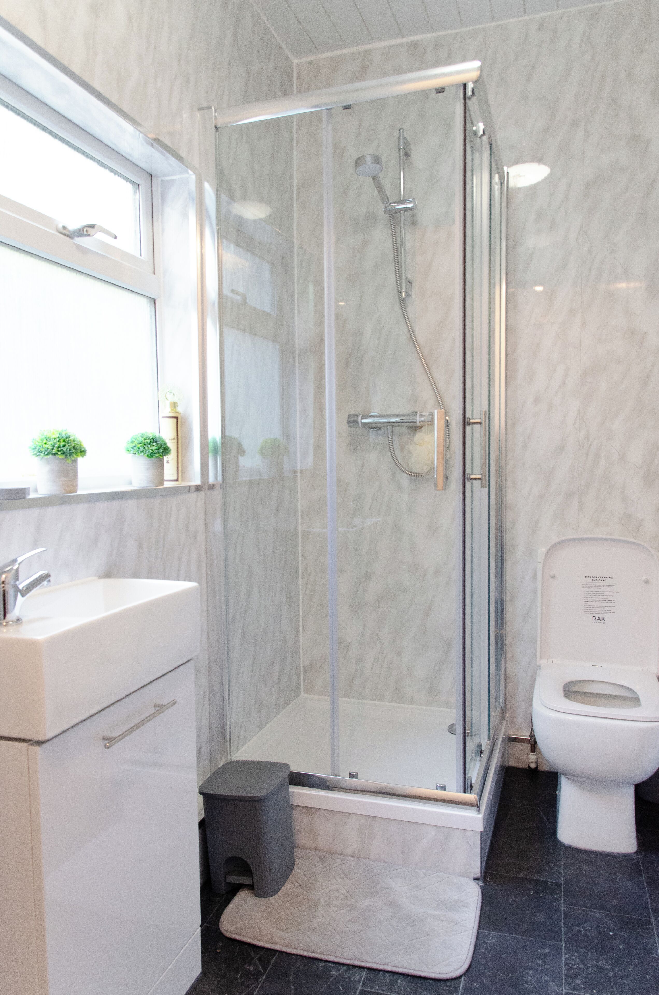 Shower, hair dryer, towels, toilet paper