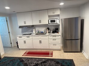 Microwave, stovetop, coffee/tea maker, cookware/dishes/utensils