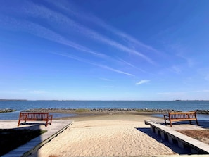 A beach with wooden benches and a clear view of the ocean. - 5 Corner Store Ln Sunset Island | Resort Community (Ocean City)