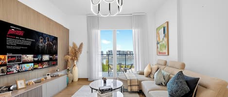 Standard Apartment, Sea View | Living room | 65-inch Smart TV with digital channels, Netflix, streaming services