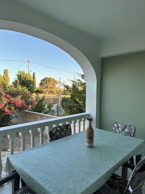 Hus - utsikt mot trädgården | Balkongutsikt