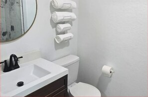 Shower, towels, toilet paper