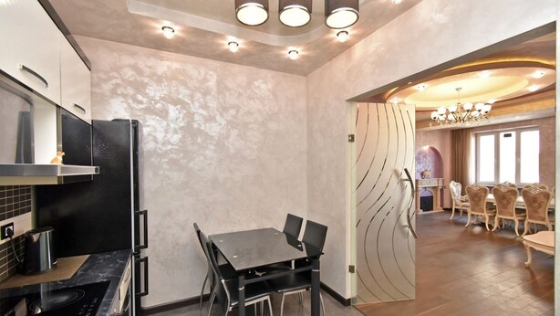A modern kitchen with a dining area. - North Ave. apartment by Luxe Group HH777 (Yerevan)
