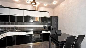 Deluxe Apartment, 2 Bedrooms | Private kitchen | Electric kettle, cookware/dishes/utensils