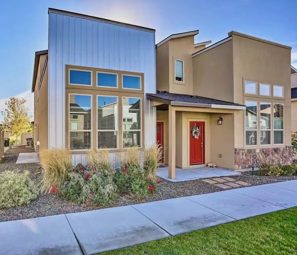 Exterior - Walk to The Village from this stylish townhome featuring 3 private king suites, each with its own bathroom. Enjoy a fully stocked kitchen, cozy fireplace, fast Wi-Fi, and attached garage—the perfect home base for families, friends, or business travel (Meridian)