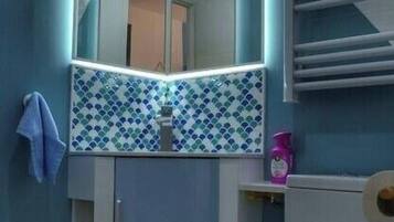 Shower, towels, toilet paper