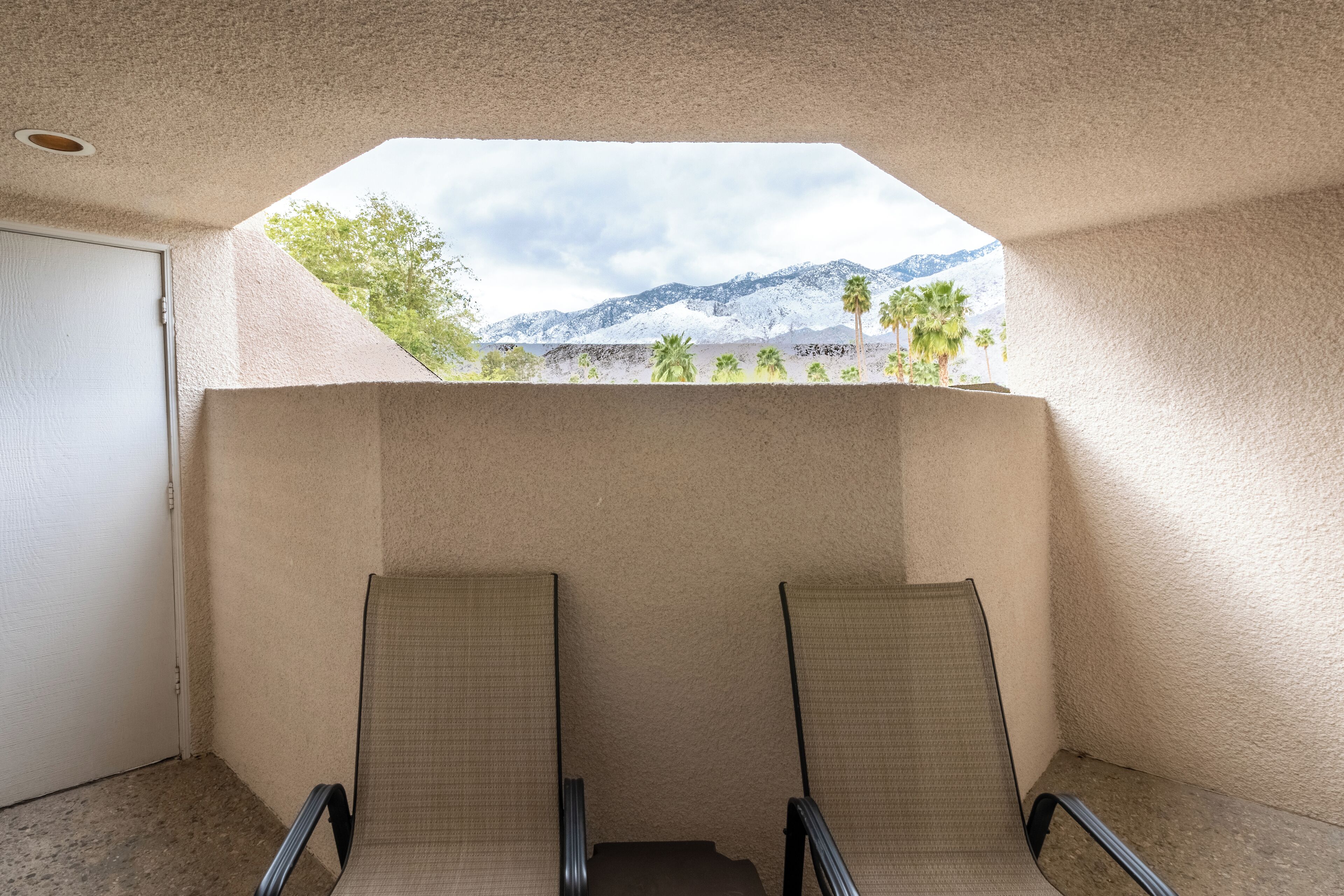 Sip coffee on the balcony with scenic mountain views.